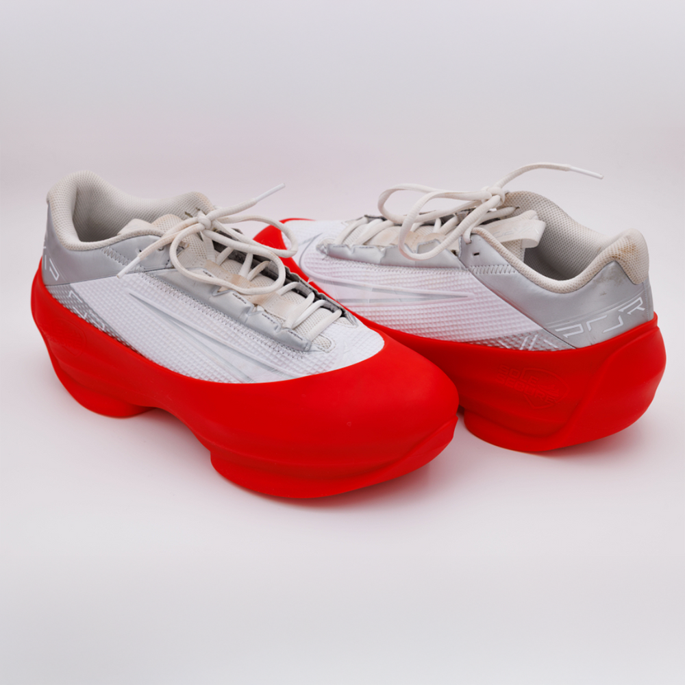 Red and gray sneakers on a white background