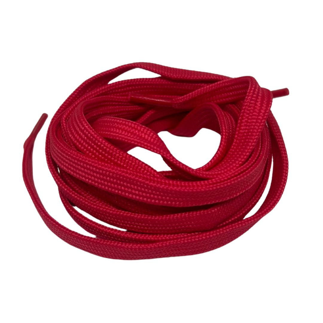 Red shoelaces coiled on a white background.