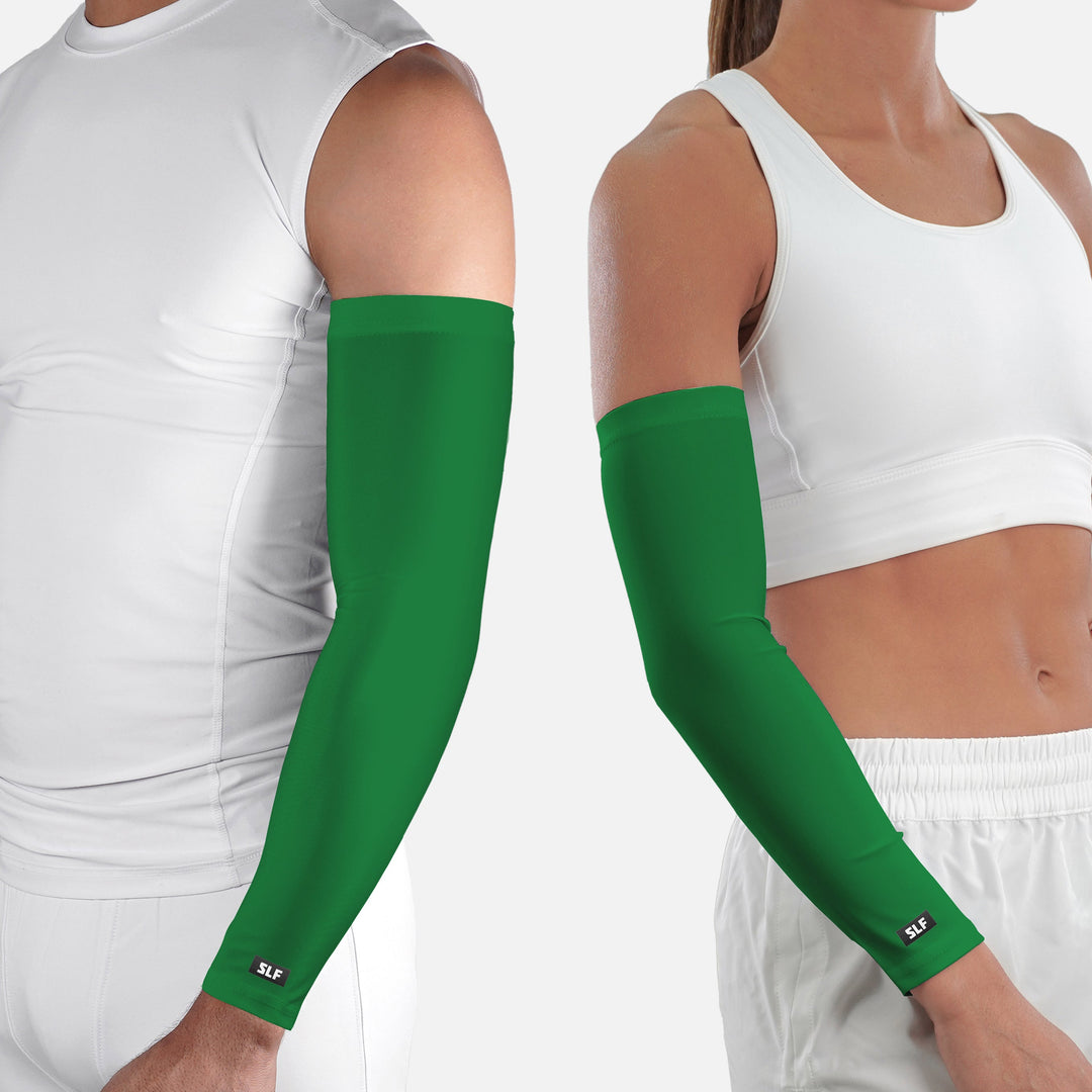 Green arm sleeves worn by a person on a white background