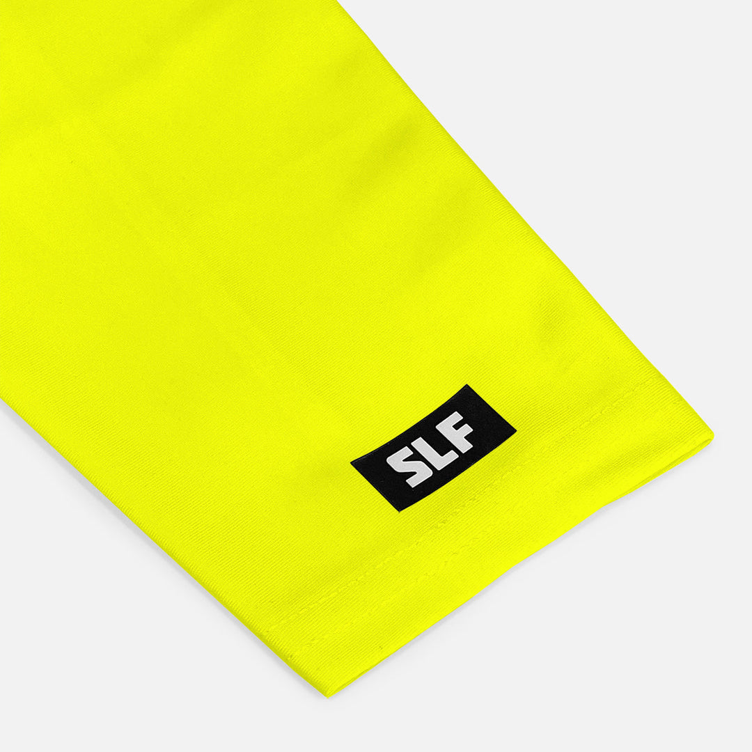 Yellow fabric with a black label featuring 'SLF' on a white background