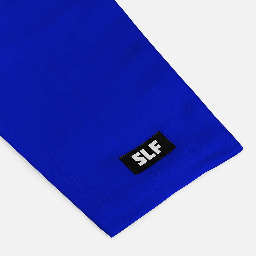 Blue fabric with a black label featuring 'SLF' on a white background