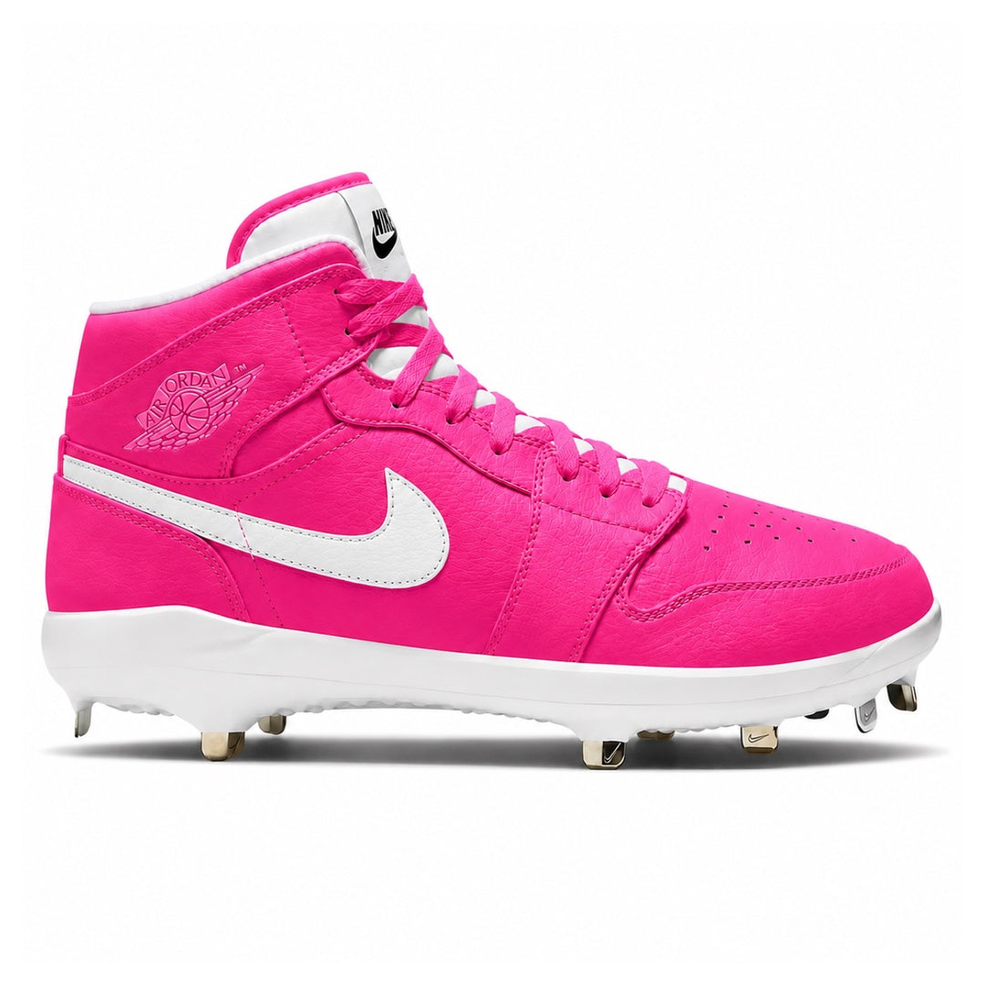 Pink Air Jordan 1 Retro mid-top baseball cleats with white Nike swoosh and metal spikes on white background by Stadium Custom Kicks