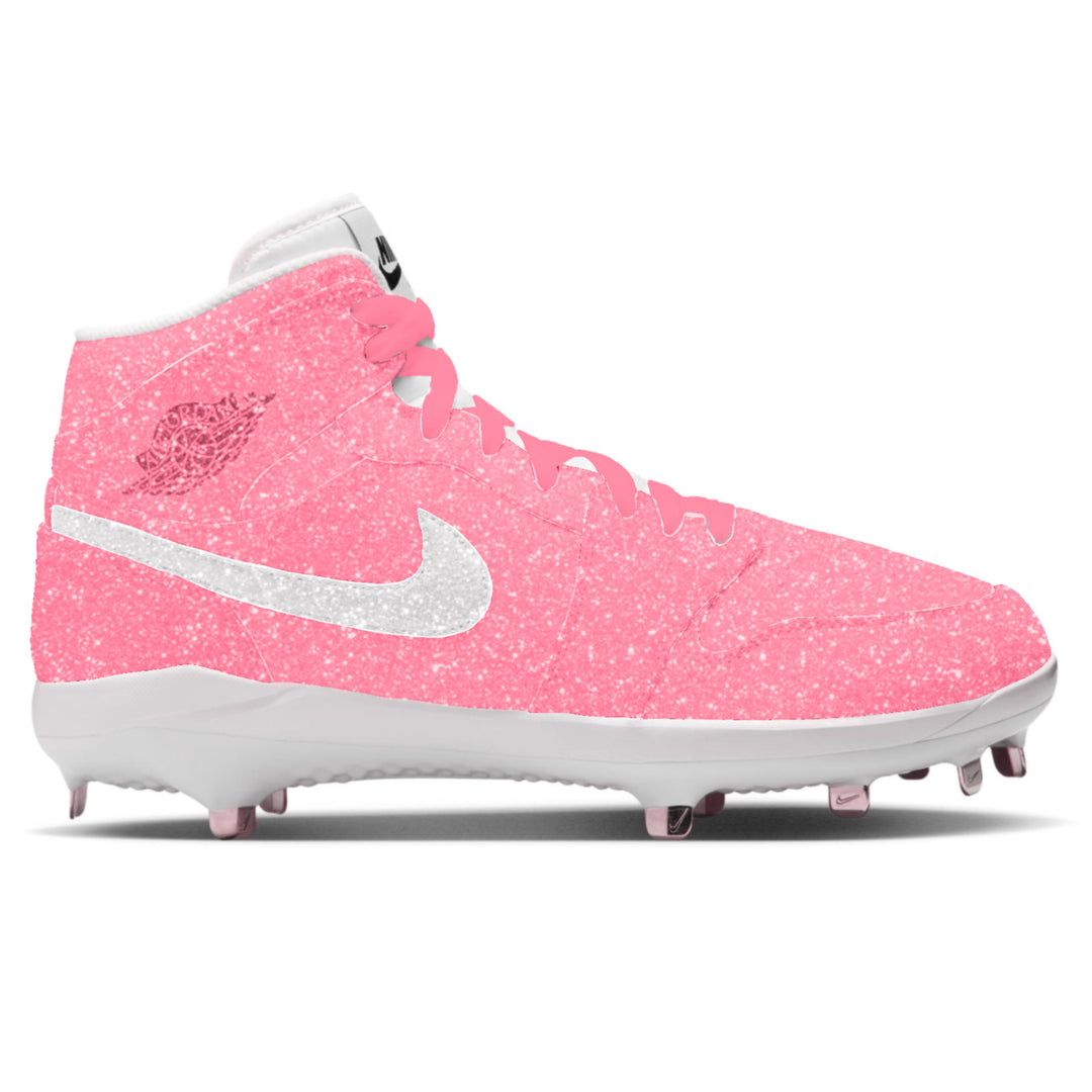 Air Jordan 1 Retro mid-top baseball cleats covered in pink glitter texture with white glitter Nike swoosh, white midsole, and metal spikes on white background by Stadium Custom Kicks
