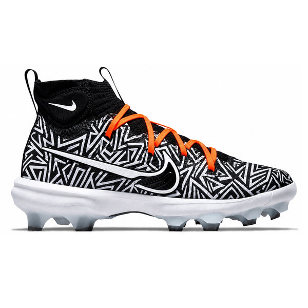 Nike Huarache NXT mid-top baseball cleats with black and white geometric tribal pattern upper, white Nike swoosh, orange laces, black knit sock collar, and white rubber cleats on white background by Stadium Custom Kicks