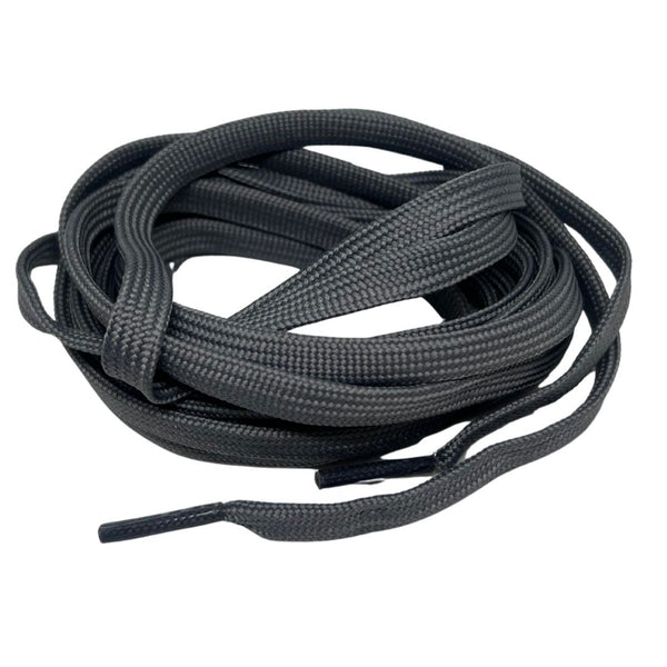 Coiled black shoelaces on a white background.