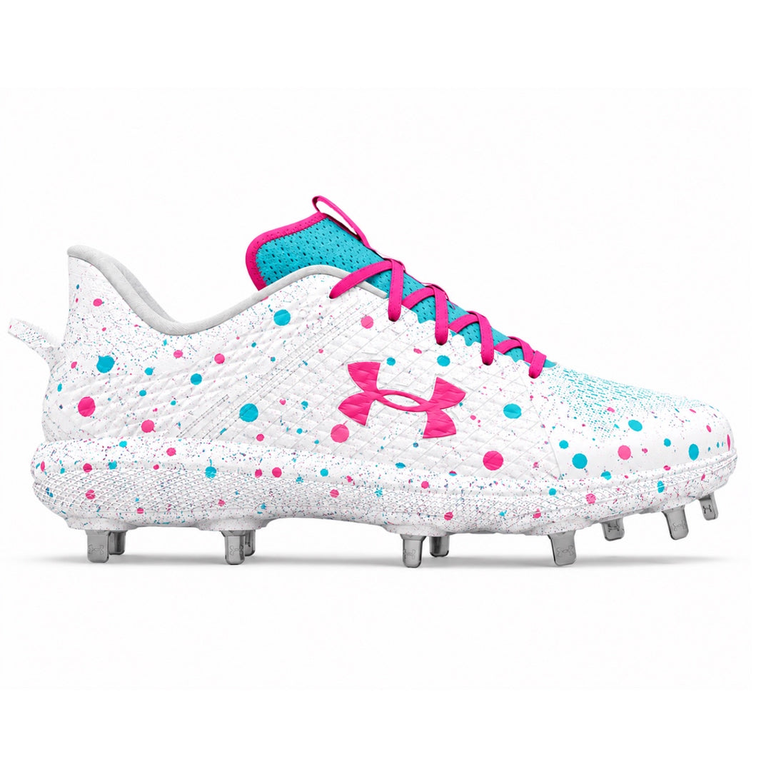 Under Armour Yard MT low-top baseball cleats in white with pink and teal confetti dot splatter print, pink Under Armour logo, pink laces, teal collar, and metal spikes on white background by Stadium Custom Kicks.