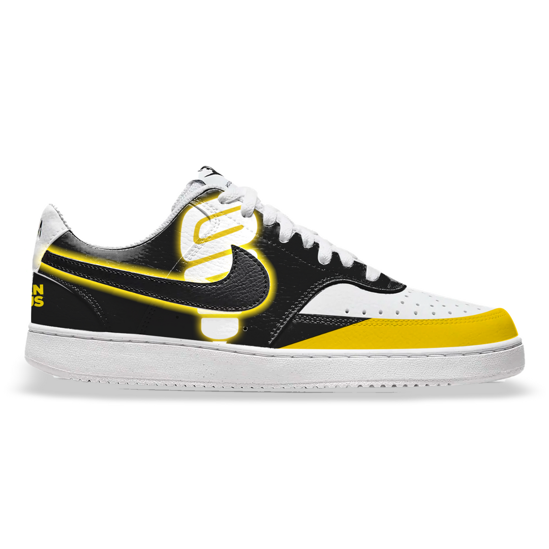 Sneaker with black and yellow design on a white background, featuring 'The Hidden Genius Project' logo.