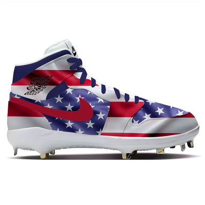 Air Jordan 1 retro baseball cleats with a waving United States flag design featuring red and white stripes, white stars, and metal spikes.