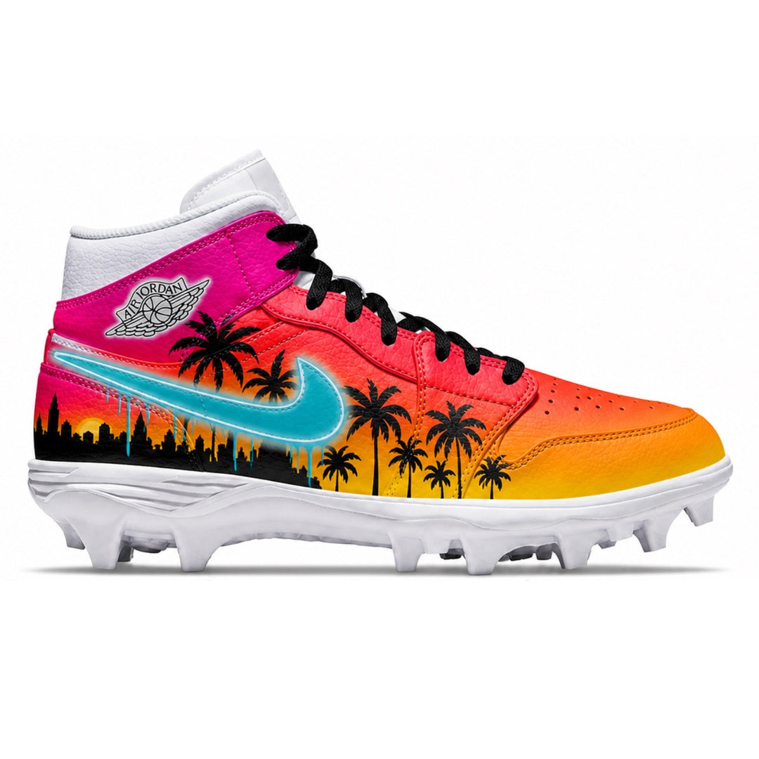 Air Jordan 1 TD Mid football cleats with pink to orange to yellow sunset gradient upper featuring black palm tree and city skyline silhouettes, teal drip Nike swoosh, black laces, and white rubber cleats on white background by stadium custom kicks.