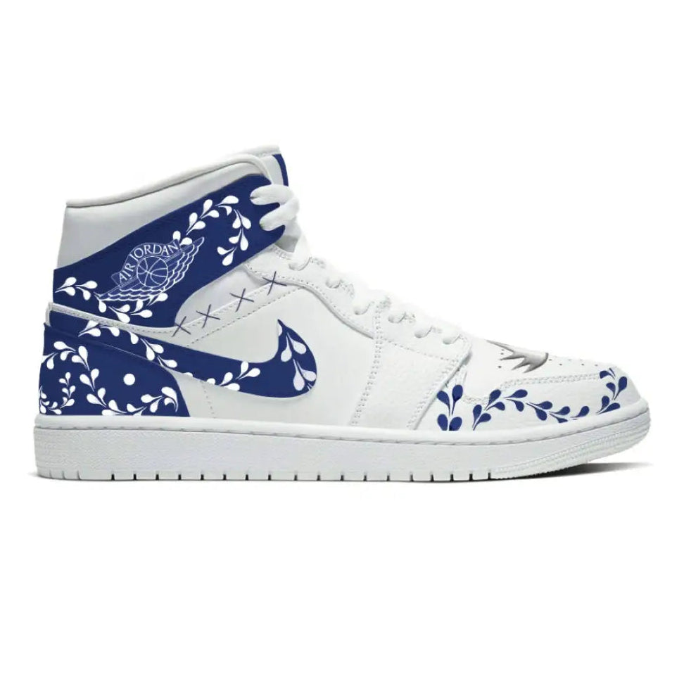 White Air Jordan sneaker with blue floral design from Azule Jordan 1 Mid Shoes collection