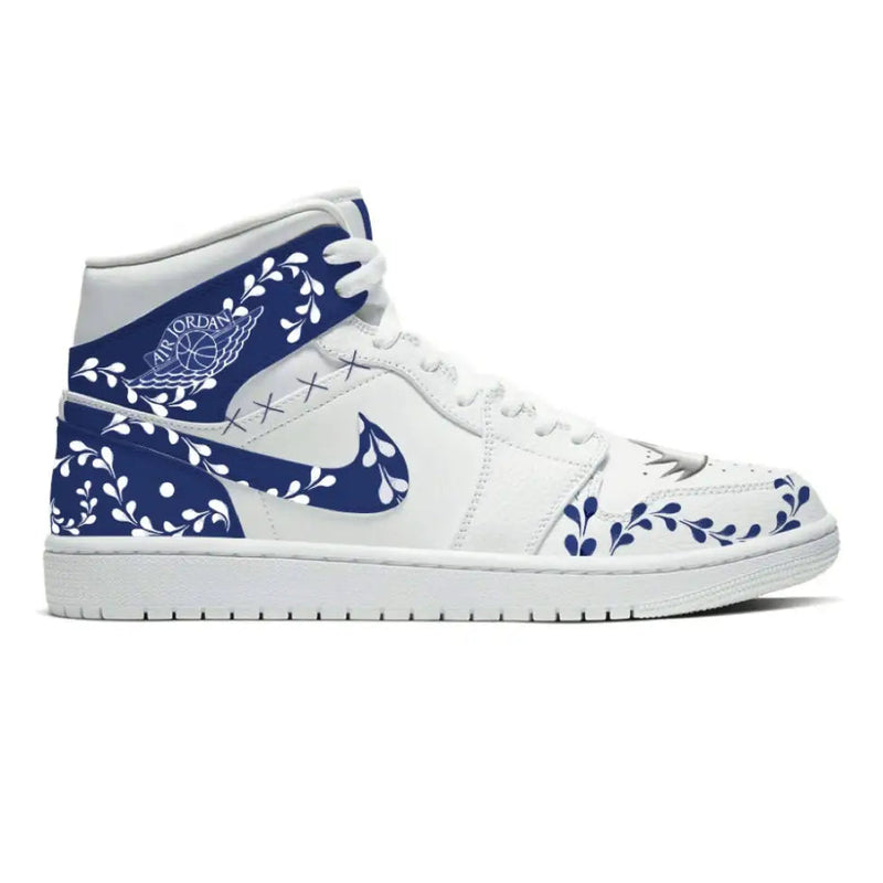White Air Jordan sneaker with blue floral design from Azule Jordan 1 Mid Shoes collection