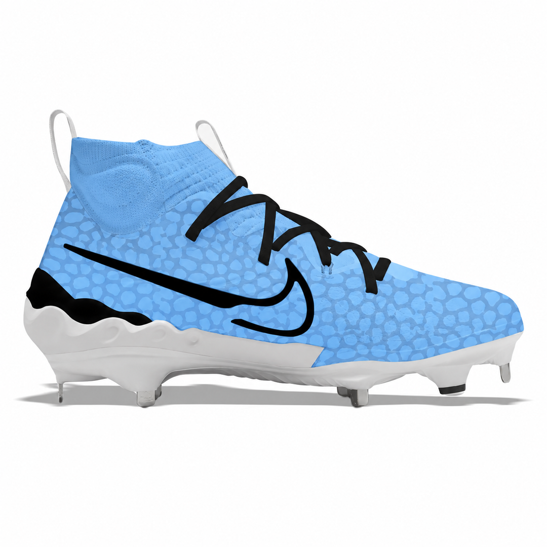 A Nike baseball cleat in light blue with a textured pattern, black swoosh and laces, and a white sole with metal studs, shown from a side profile on a white background.