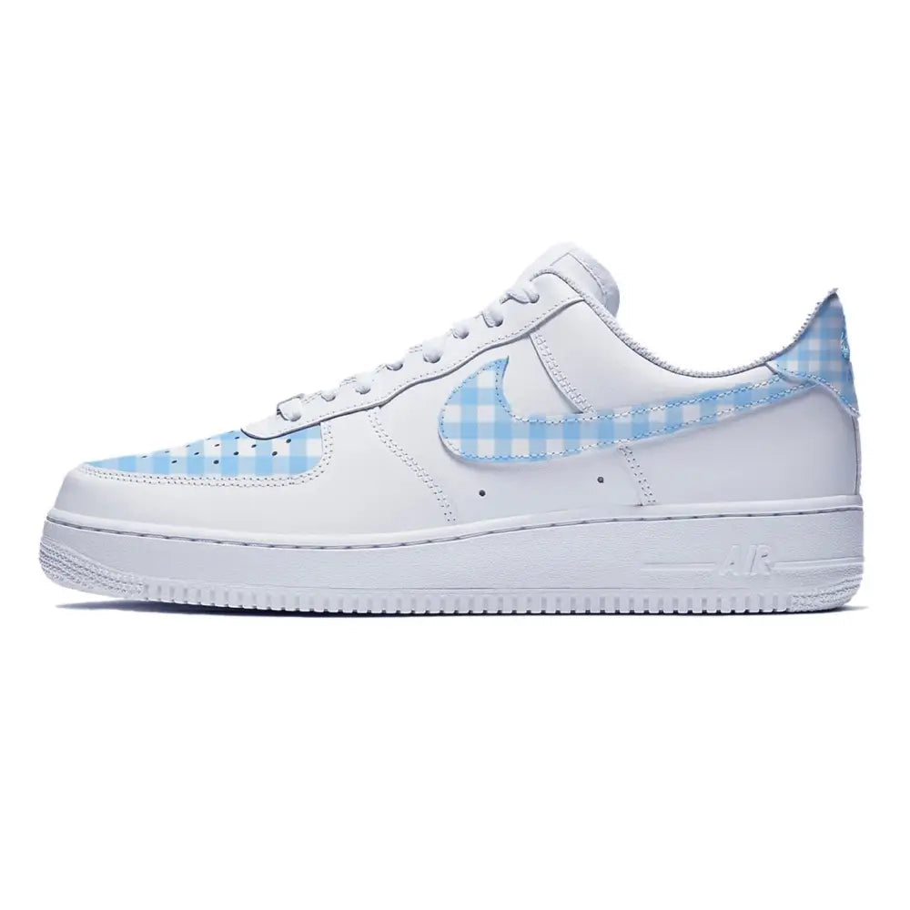 White Nike Air Force 1 Low sneaker with blue gingham accents and custom blue plaid detailing