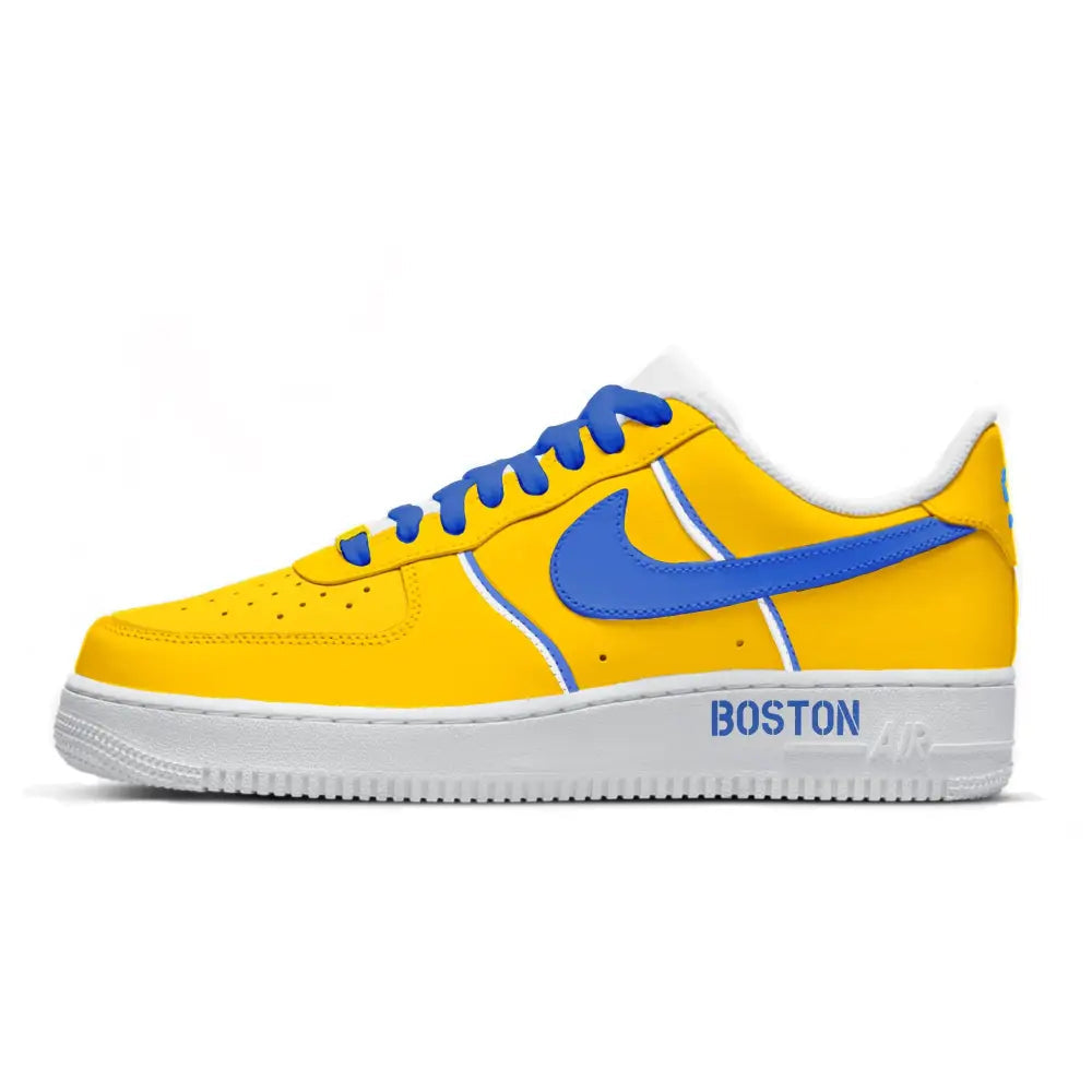 Yellow sneaker with blue accents and 'Boston' text on a white background