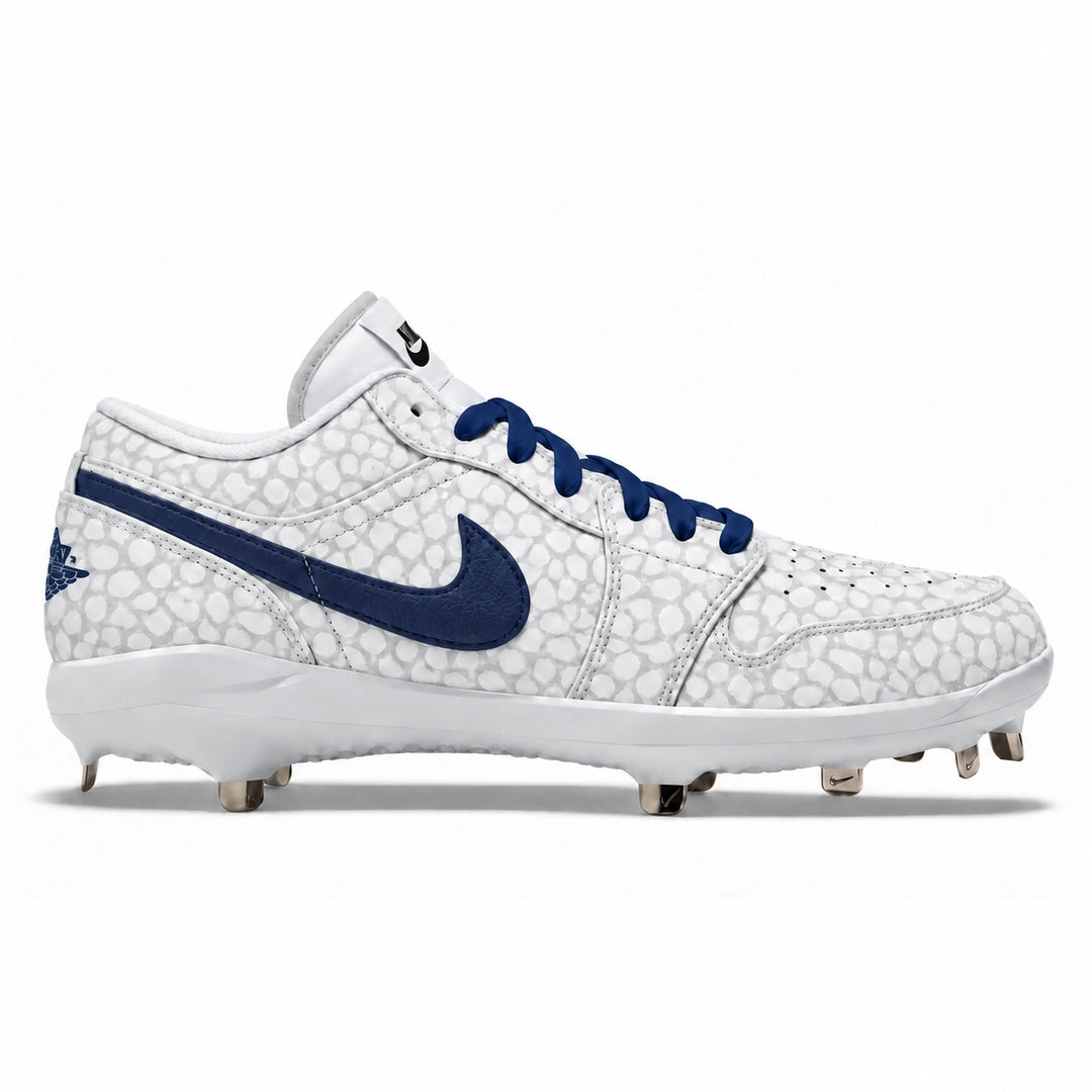 A Nike baseball cleat in white with a snake print pattern, featuring a navy blue Swoosh and matching navy laces, shown in a side profile on a white background.