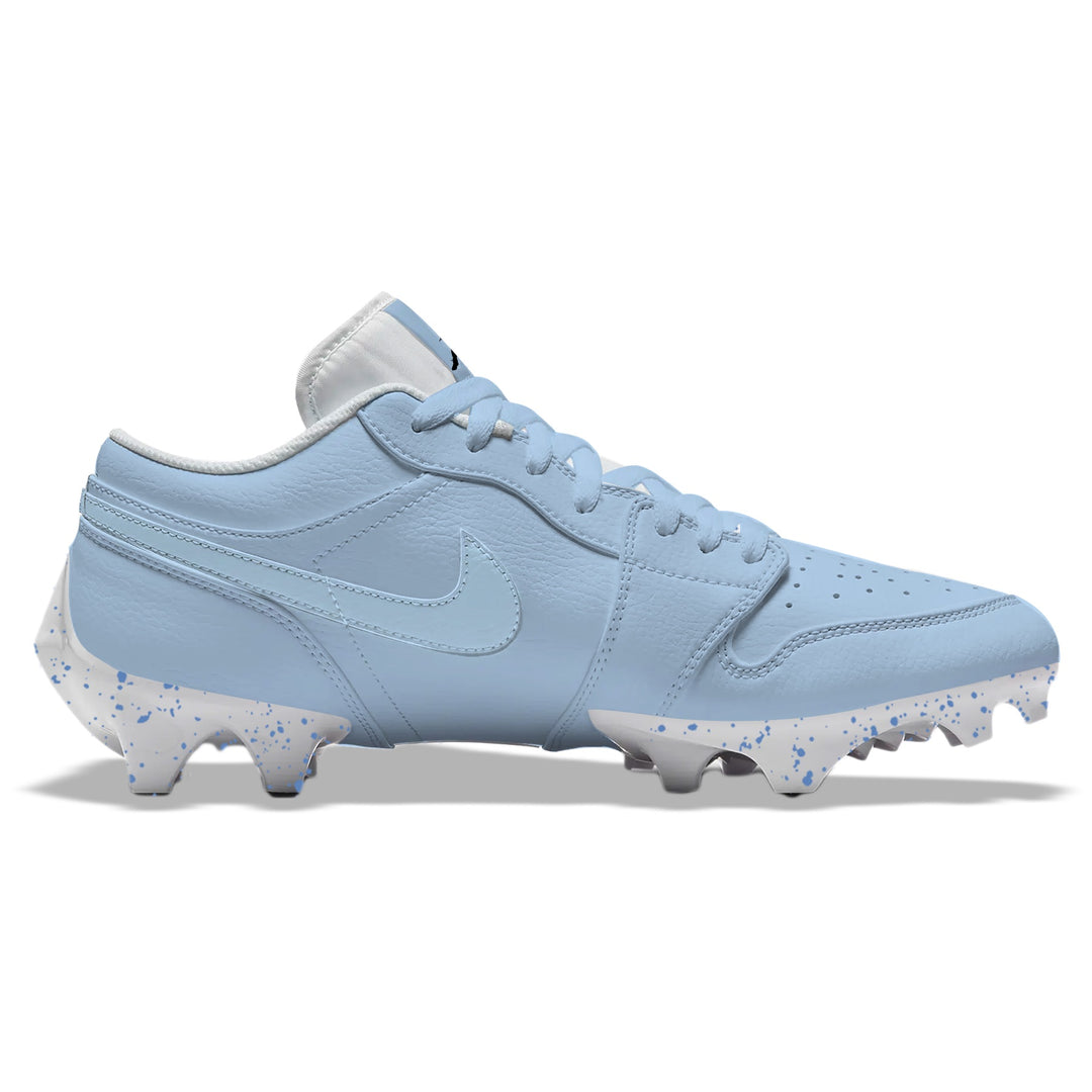Carolina Color Rush Jordan 1 Vapor Edge Low football cleats in light blue with tonal Nike Swoosh and white splatter-patterned sole, side profile on a white background.