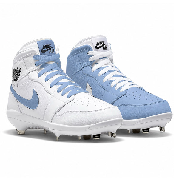White and light blue Nike Air baseball cleats on a white background