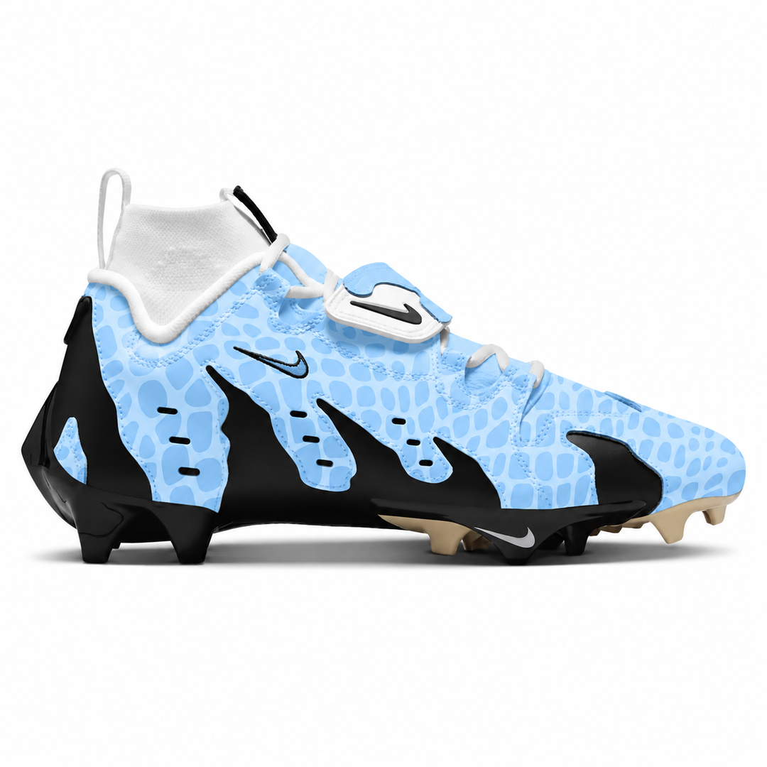A Nike high-top football cleat in light blue and black with a textured pattern, featuring a white collar and beige studs, shown from a side profile on a white background.