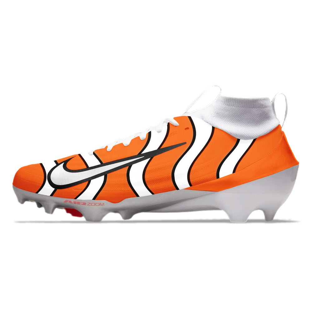 Orange and white football cleats with a finding nemo fish pattern on a white background
