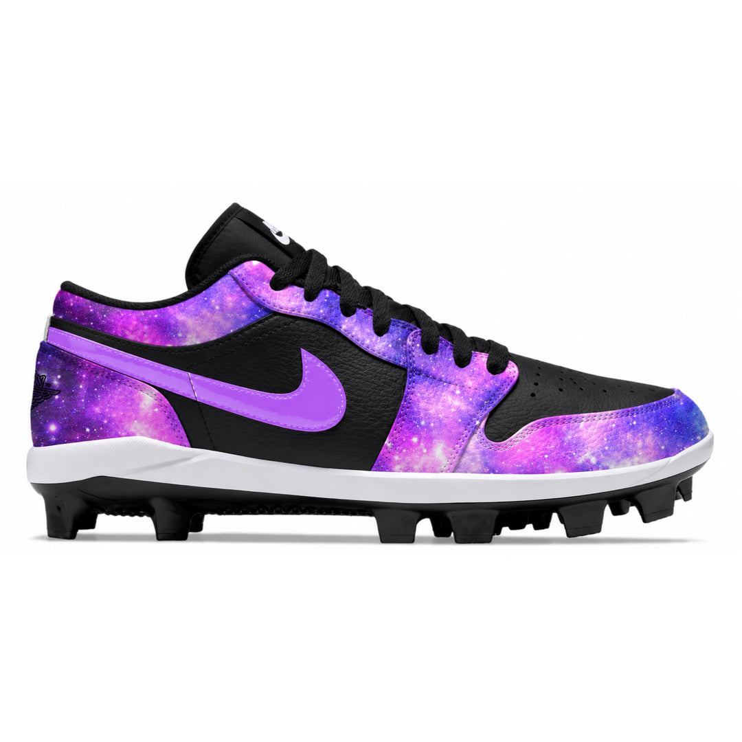 A Jordan baseball cleat featuring a black and purple galaxy print upper, black Swoosh, black laces, and black studs on a white midsole, shown against a plain white background.