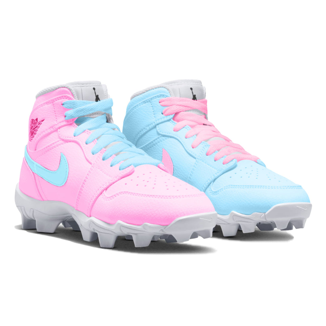 light blue and pink mismatched mid top youth cleats in a side view.