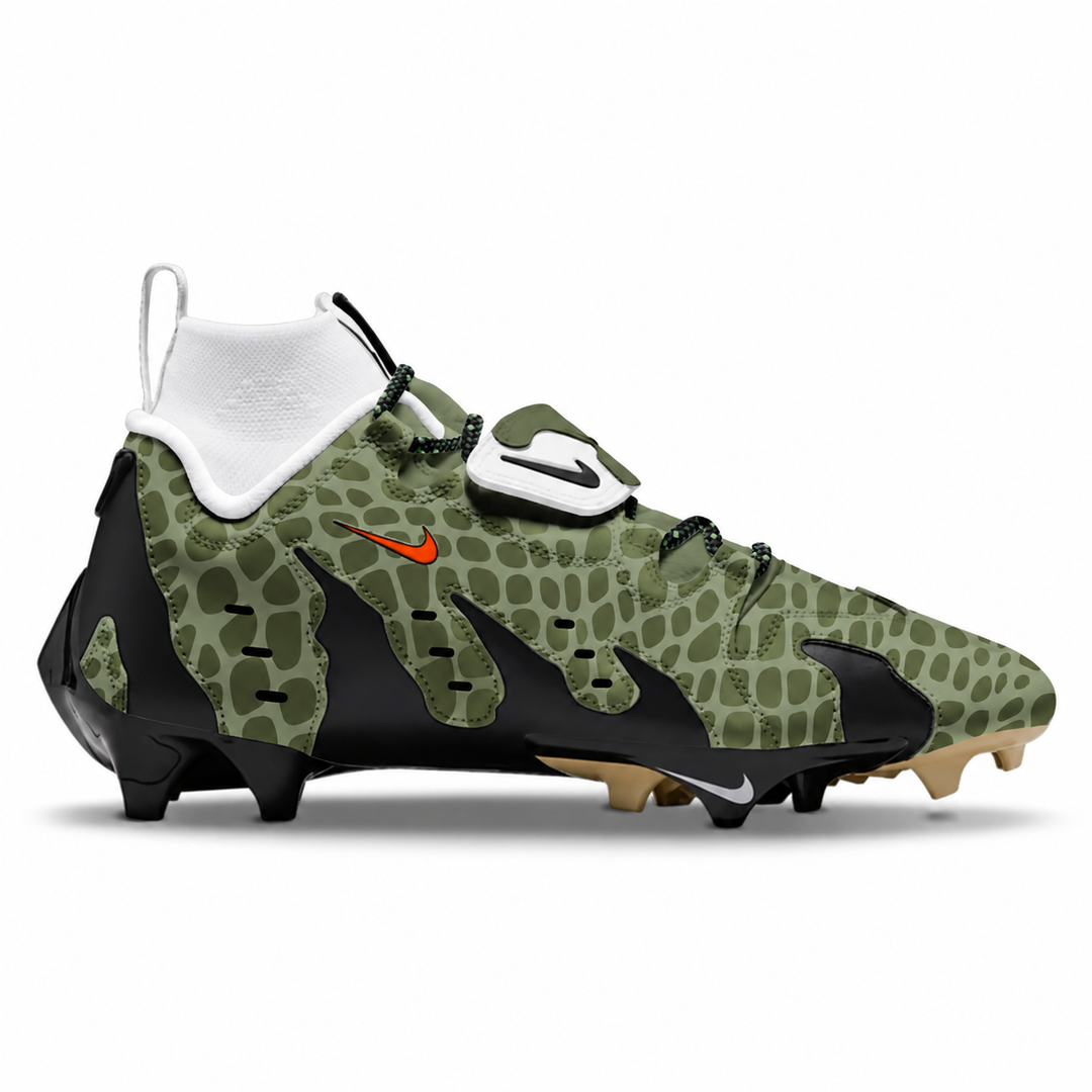 A Nike high-top football cleat in olive green with a crocodile skin pattern, black accents, a white Nike logo on the strap, and a small orange Nike swoosh, shown against a plain white background.