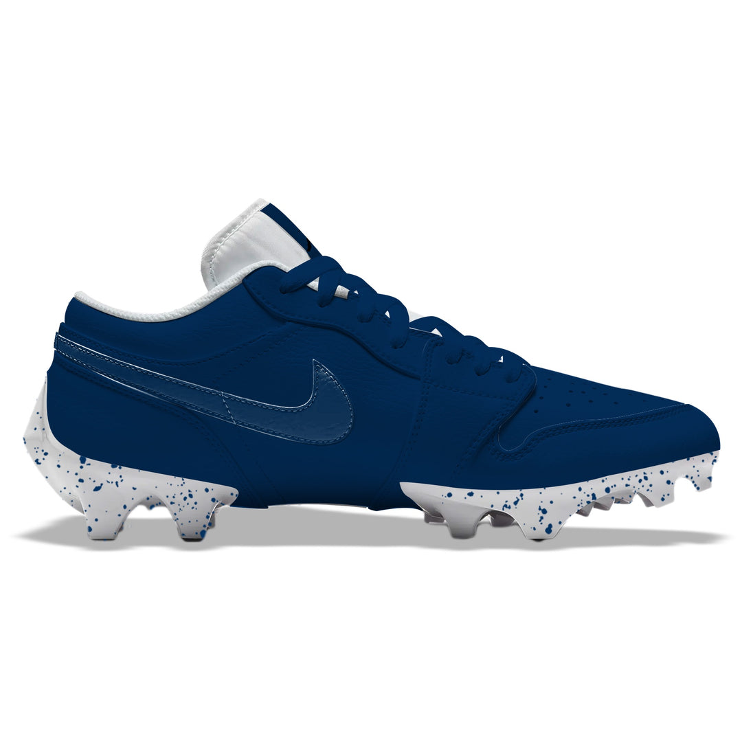 Dallas Color Rush Jordan 1 Vapor Edge Low football cleats in navy blue with tonal Nike Swoosh and white splatter-patterned sole, side profile on a white background.