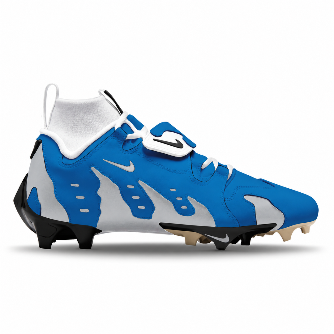 A Nike football cleat in blue, white, and gray with black and beige studs, shown from a side profile on a white background.