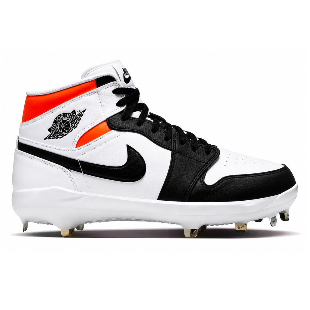Jordan 1 Retro baseball cleats with white leather upper, black overlays and swoosh, bright orange collar accent, black laces, and white metal spike sole, side view
