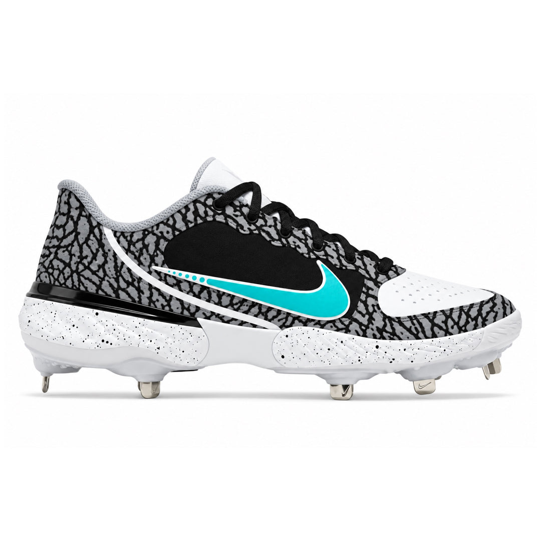 A Nike baseball cleat featuring a black and gray elephant print pattern, a black side panel, a bright turquoise Nike Swoosh, and a white speckled sole with metal studs, shown against a plain white background.