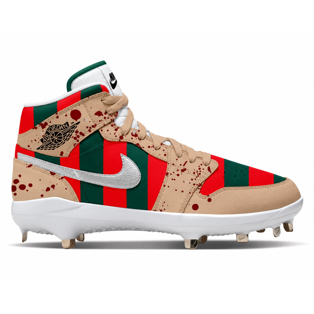 A high-top baseball cleat featuring a beige leather base with red and green striped panels, red blood splatter details, a metallic silver swoosh, and a black Jordan Wings logo on the side.