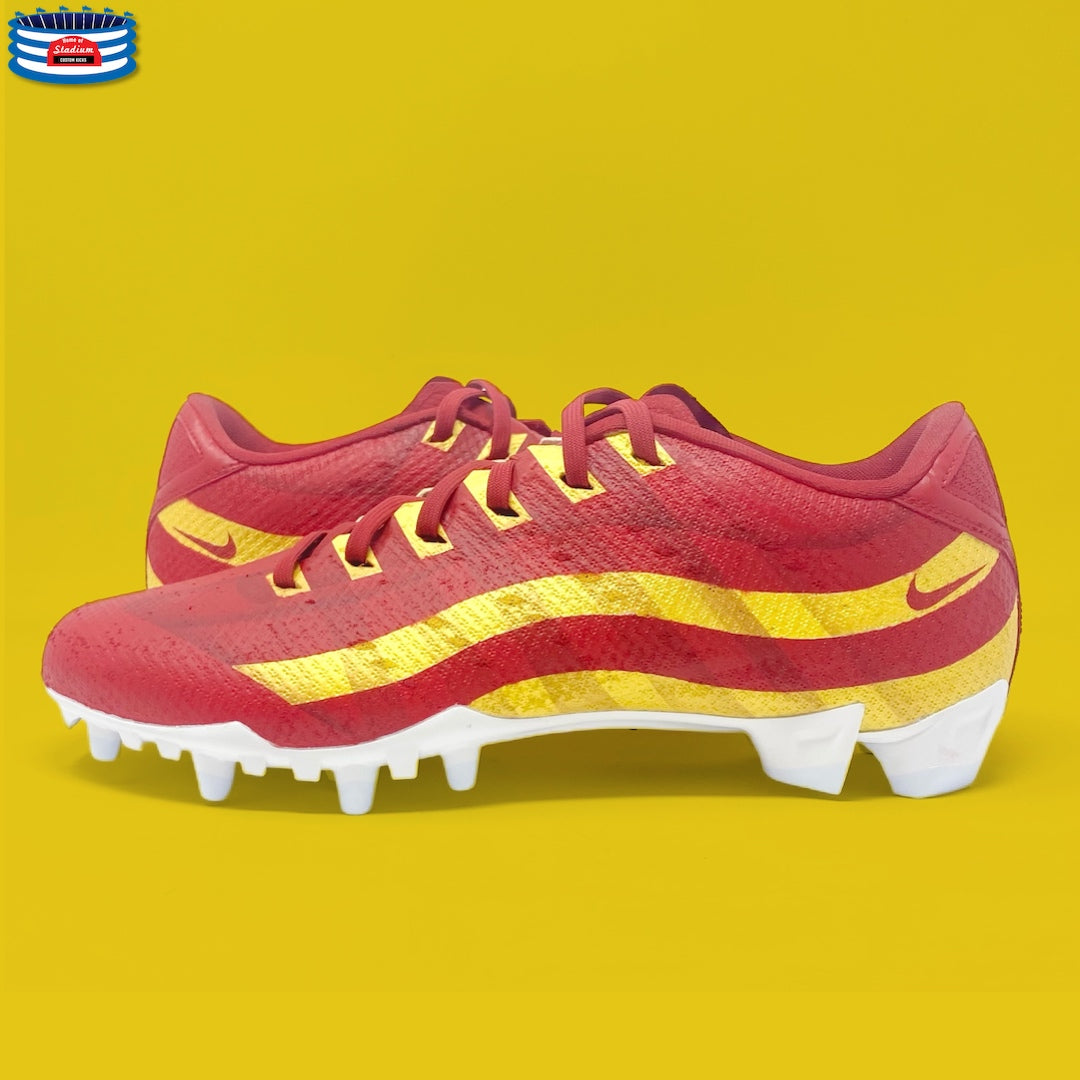 Red and gold Nike football cleats on display in the Full Custom product image