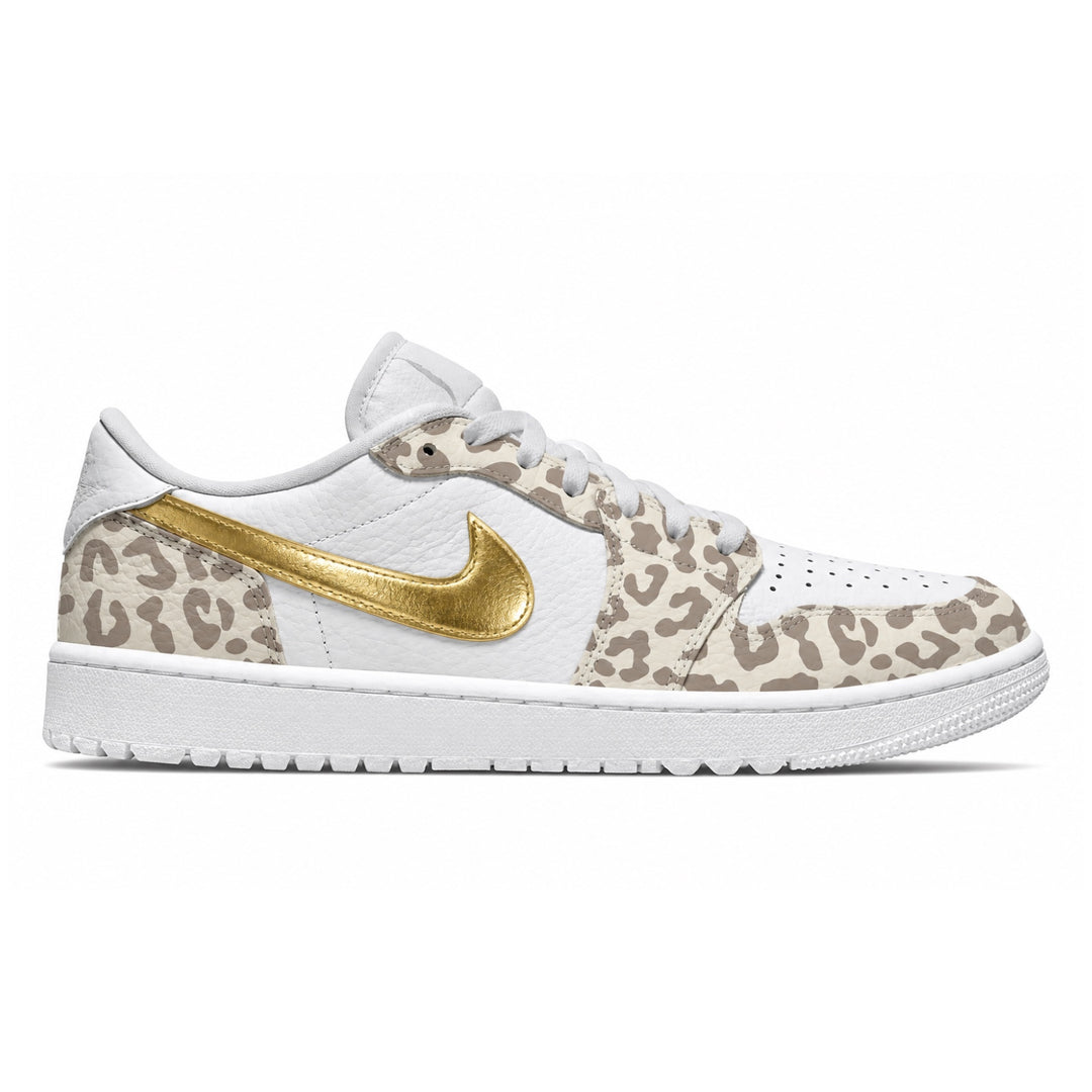 White Jordan 1 Low golf shoes featuring beige leopard print overlays, a metallic gold Nike Swoosh, white leather uppers, white laces, and a white golf outsole.