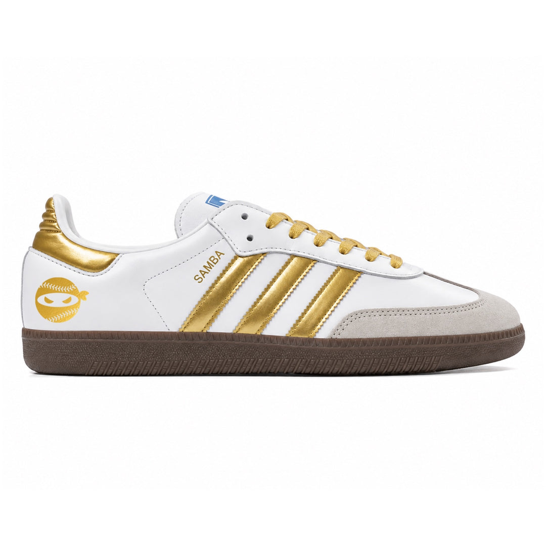 White sneaker with gold accents on a white background