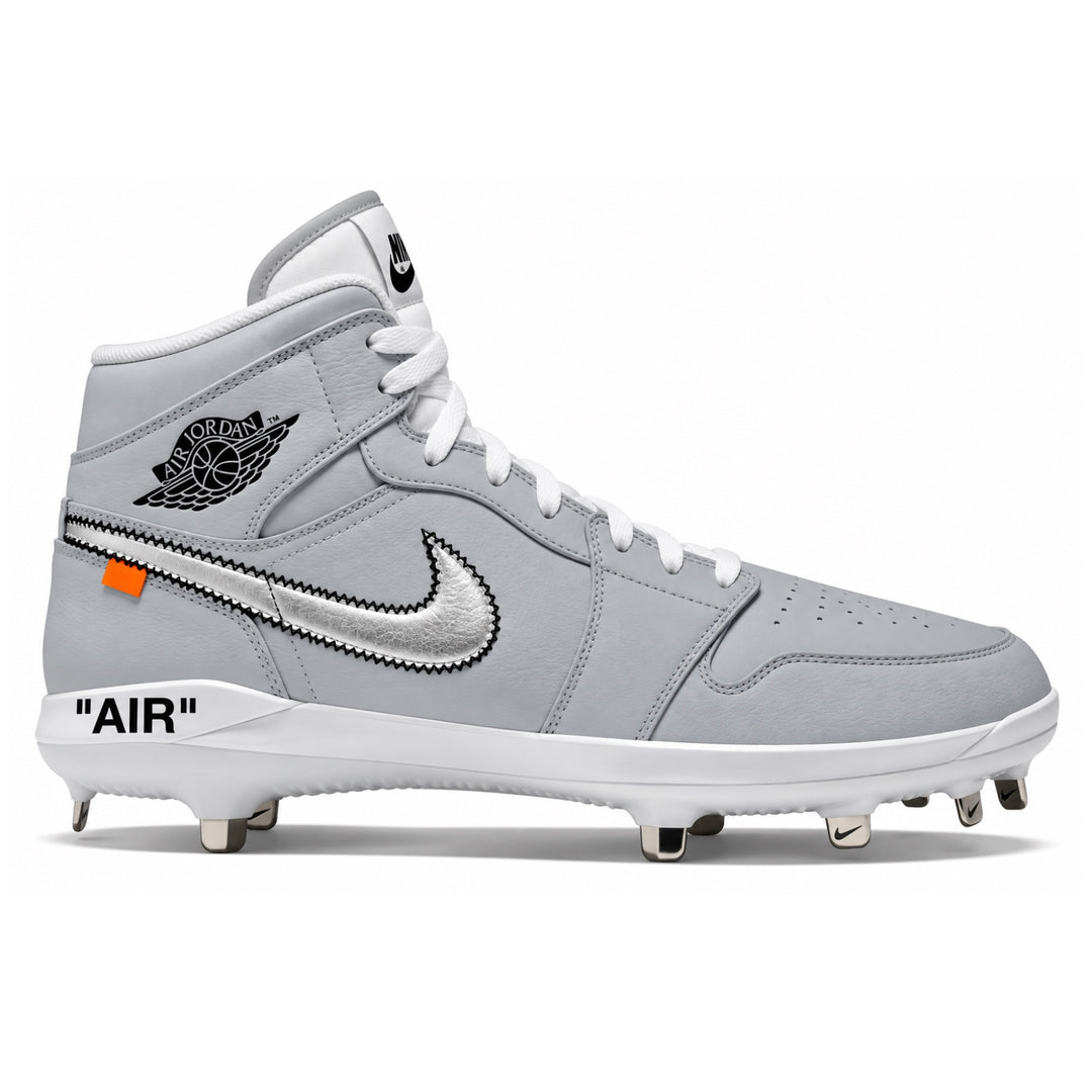 A light gray and white high-top Nike baseball cleat featuring a silver metallic Swoosh with a black zigzag pattern, a black Jordan Wings logo, and 'AIR' text on the heel, shown against a plain white background.
