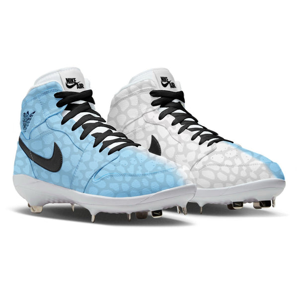 Ice Venom Split Jordan 1 Retro Baseball Cleats featuring a baby blue and white split colorway with black Nike Swoosh, snakeskin texture upper, Nike Air collar, and metal spike outsole by Stadium Custom Kicks