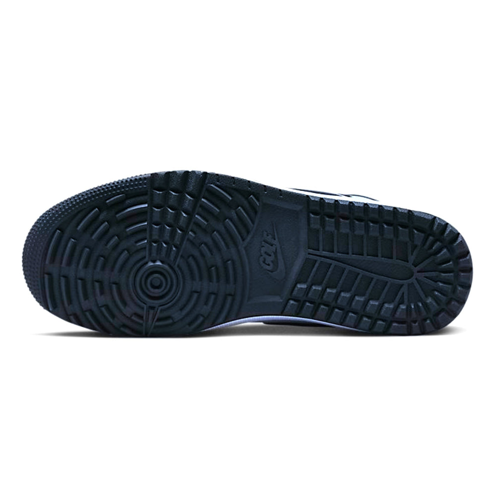 Navy shoe sole with golf tread pattern on a white background