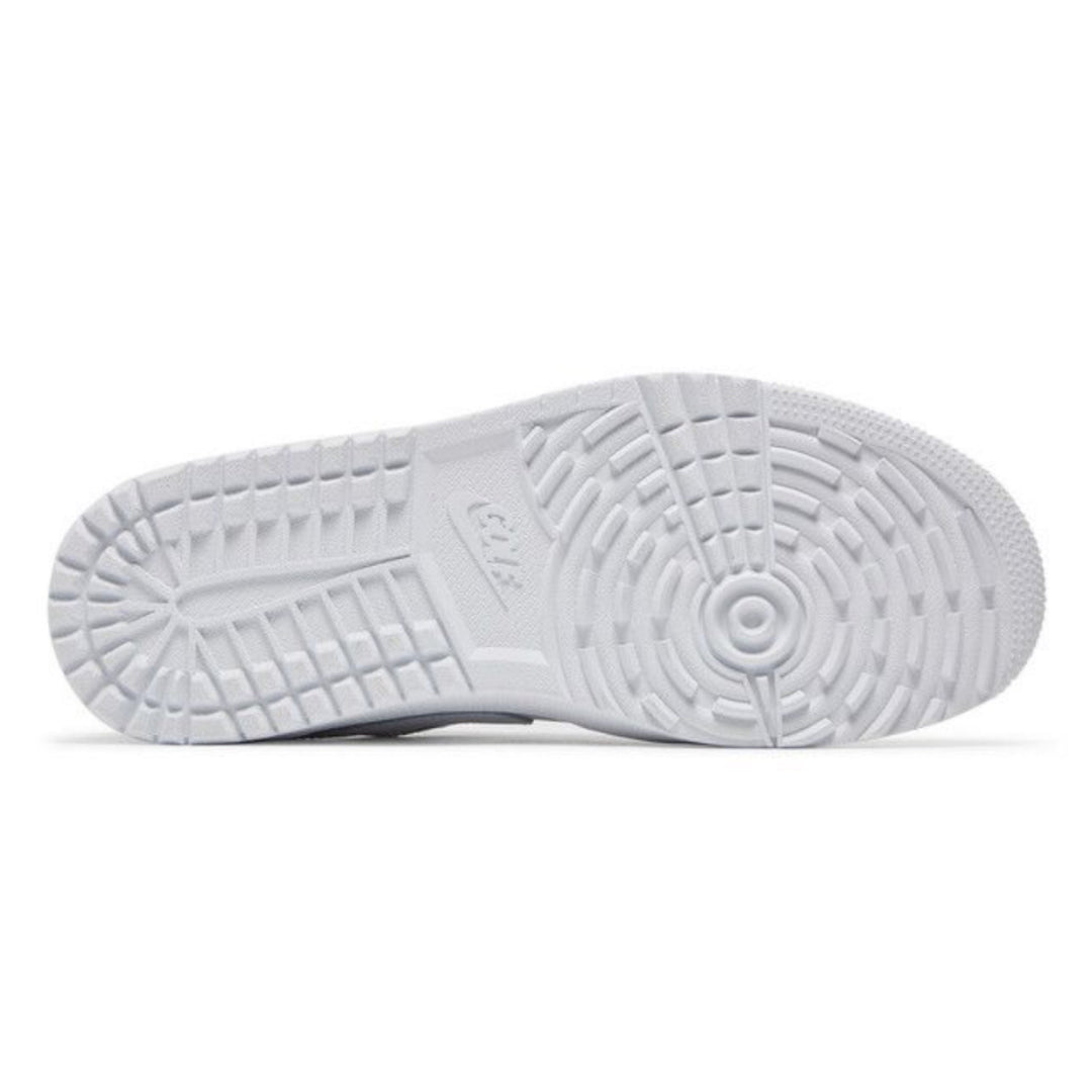 White golf shoe sole with spikeless tread pattern on a white background