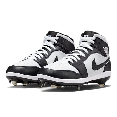 Angled view of custom Jordan 1 Retro Panda mid-top baseball cleats with metal spikes, hand-painted in black and white.