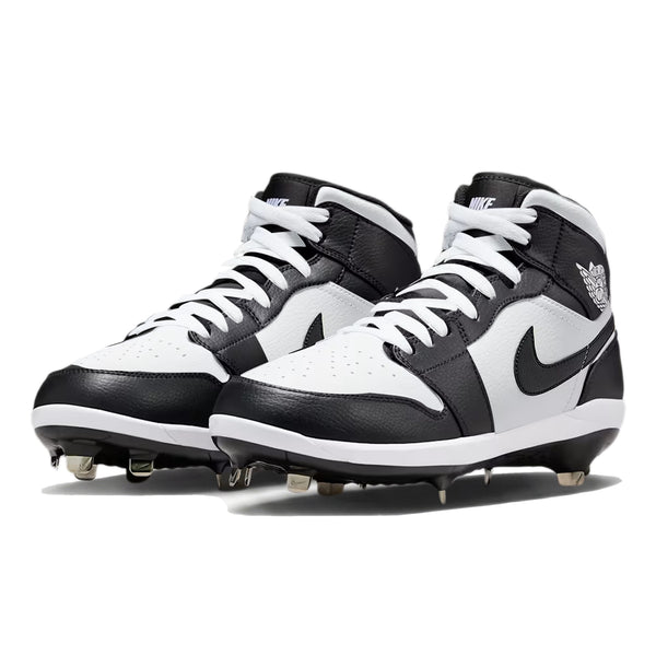 Angled view of custom Jordan 1 Retro Panda mid-top baseball cleats with metal spikes, hand-painted in black and white.