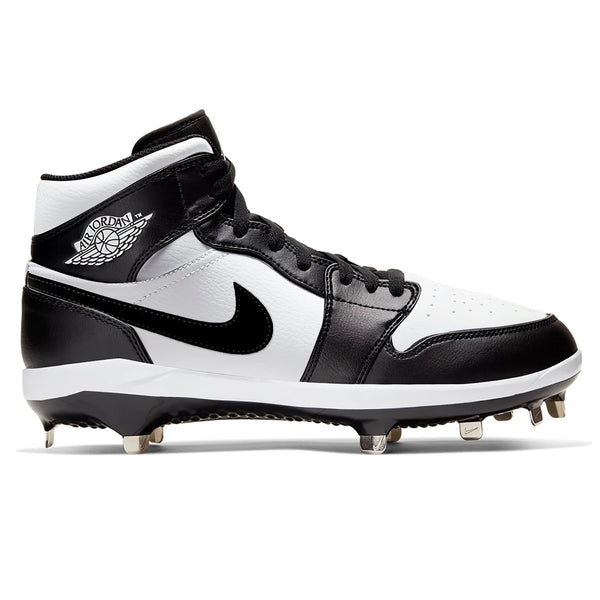 Side view of custom Jordan 1 Retro Panda mid-top baseball cleats with metal spikes, hand-painted in black and white.