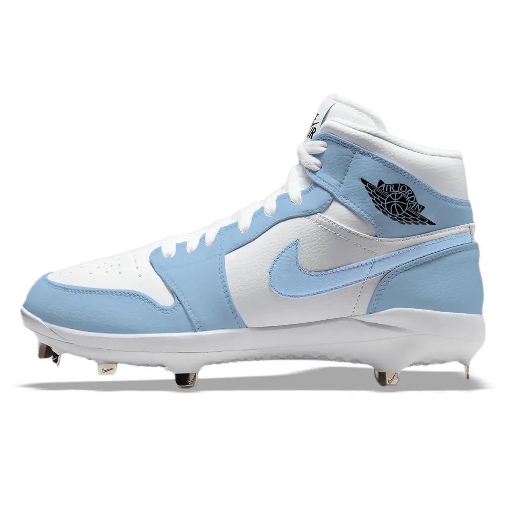 Hand-painted Jordan 1 UNC custom mid-top baseball cleats with metal spikes shown in a detailed side profile view in Carolina blue and white.