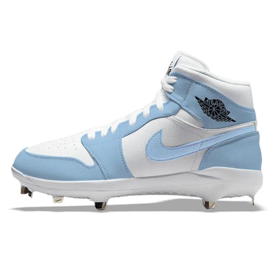 Hand-painted Jordan 1 UNC custom mid-top baseball cleats with metal spikes shown in a detailed side profile view in Carolina blue and white.