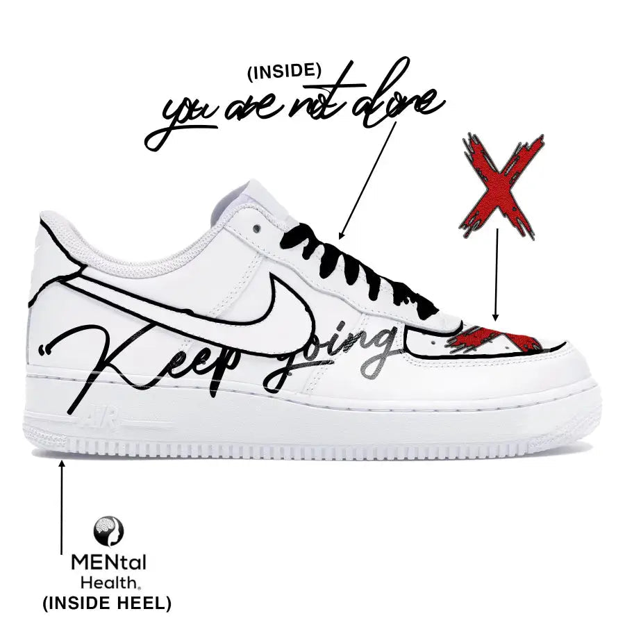 White sneaker with black text and red accents on a white background