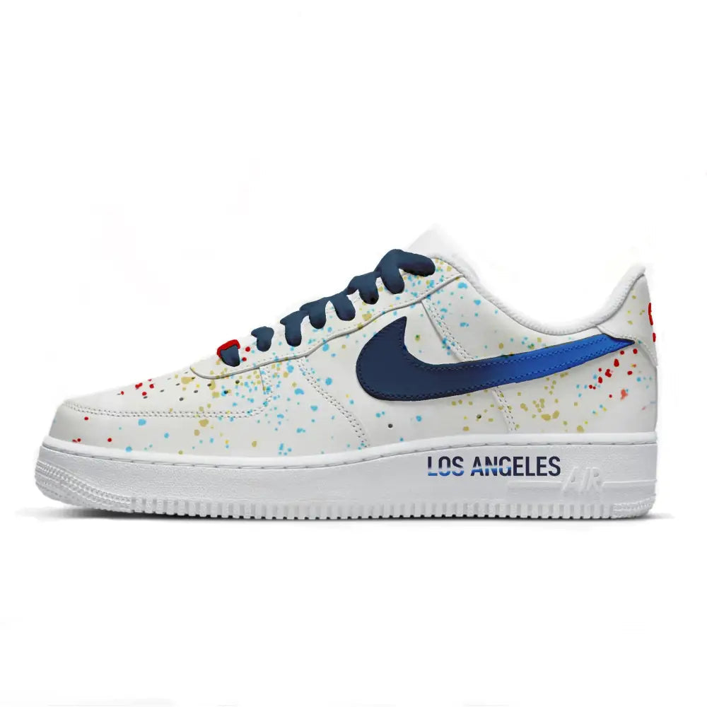White sneaker with colorful splatter design and 'Los Angeles' text on a white background
