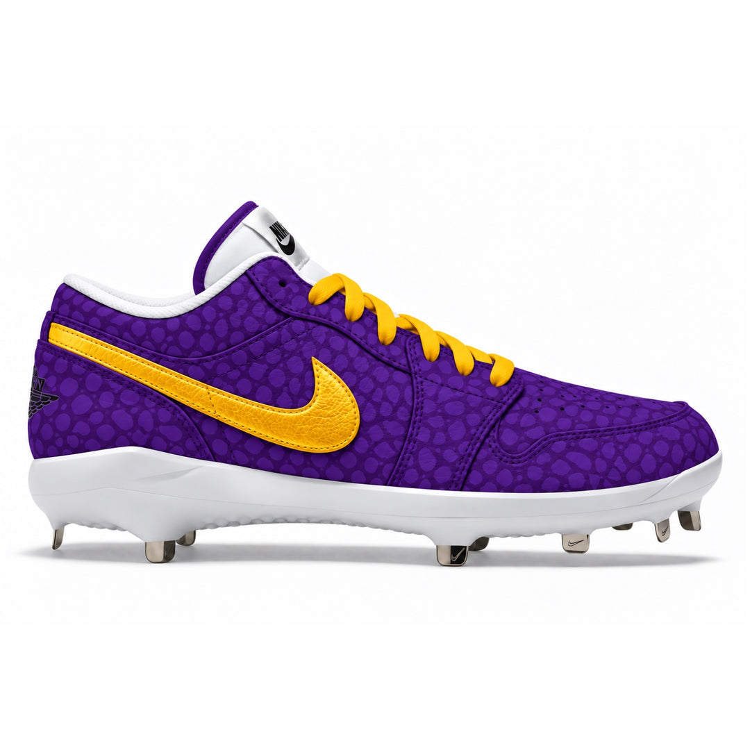 A Nike baseball cleat in purple with a textured pattern, featuring a metallic gold Swoosh, yellow laces, and a white sole with metal studs, shown from a side profile on a white background.