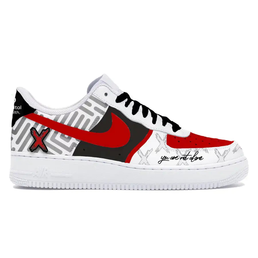 White sneaker with red and black design on a white background