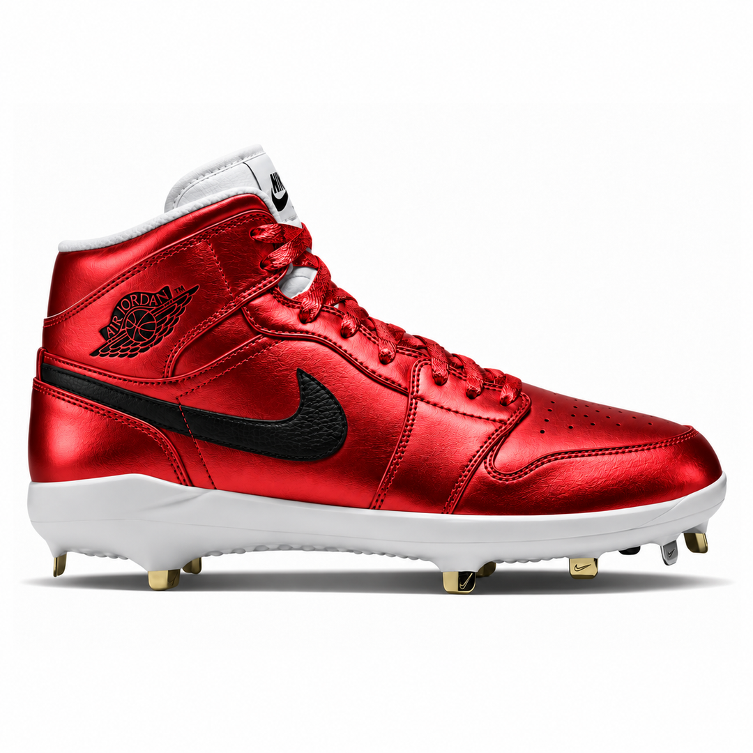 A metallic red high-top baseball cleat with black accents, featuring a black Nike Swoosh and Jumpman logo, a white midsole, and gold metal studs, shown against a plain white background.