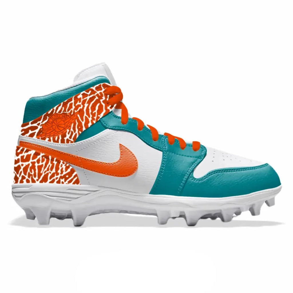 White, orange and Dolphins teal mid top football cleats on a white background.
