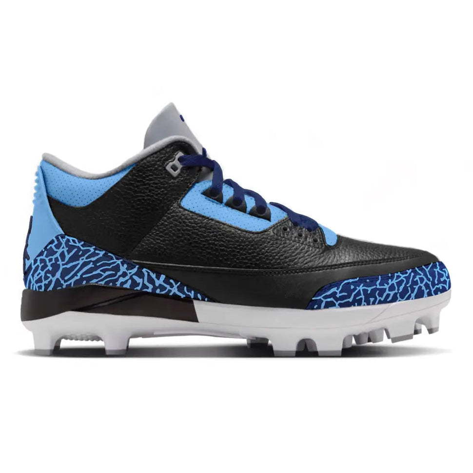 A Jordan baseball cleat featuring a black textured leather upper, light blue accents on the collar, laces, and overlays, and a blue and black elephant print pattern on the midsole, set against a plain white background.